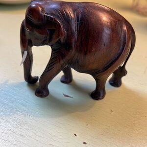 Vintage hand carved wooden elephant inlay eyes with tusks.